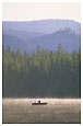 Man in boat fishing in Trillium Lake